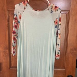 This is a light blue shirt with floral sleeves.